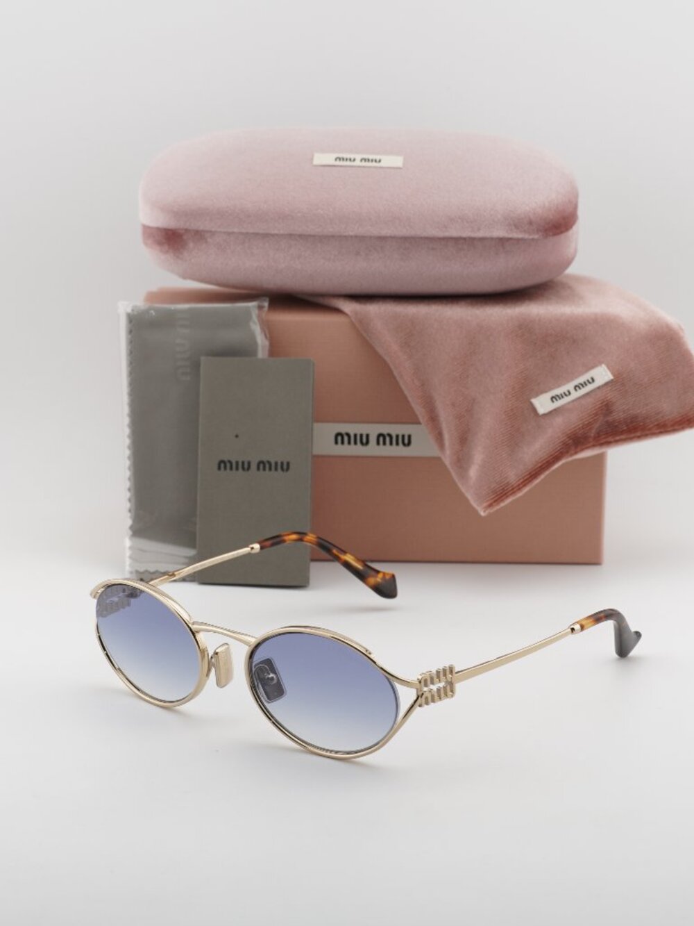 Miu Miu MU52YS ZVN80O Oval Sunglasses – Gold / Blue Gradient